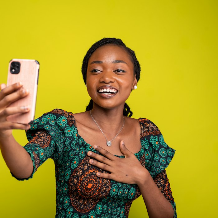 A woman smiling on a video call