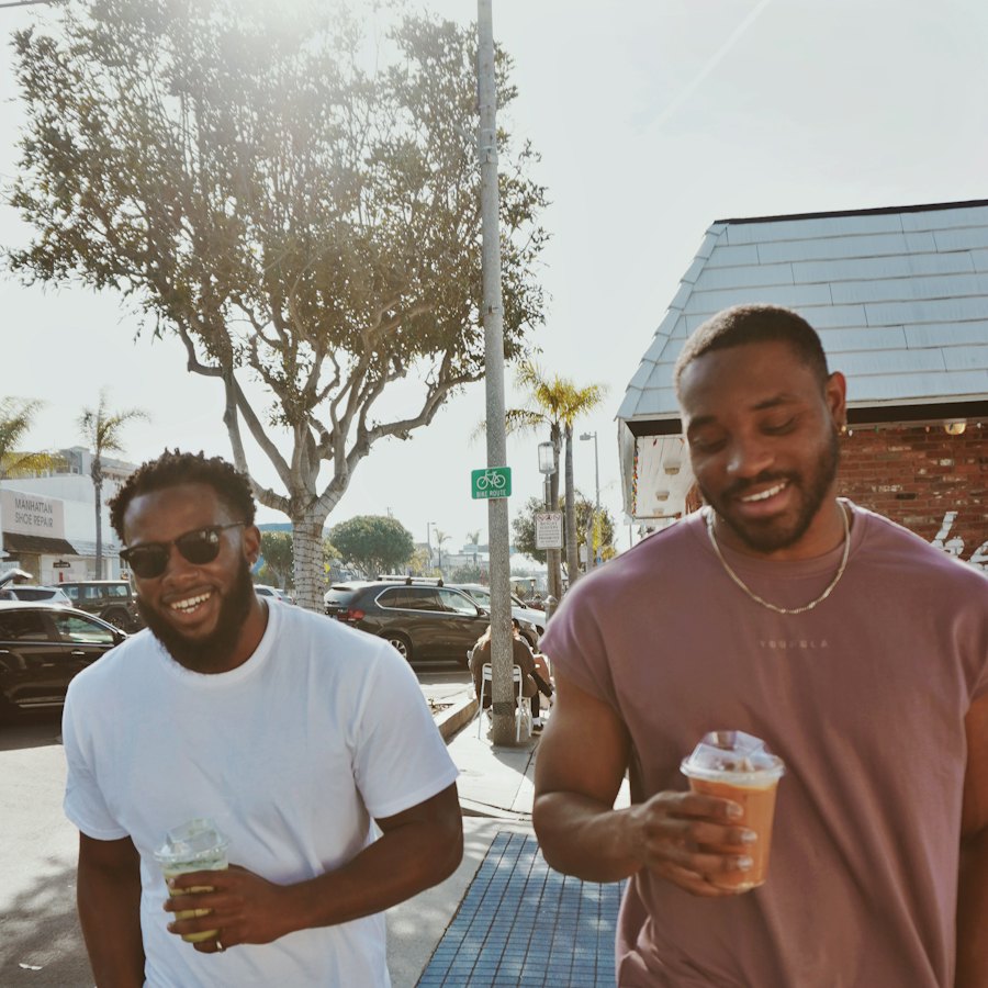 Two friends laughing on a walk