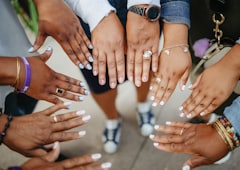 Hands gathered in a circle